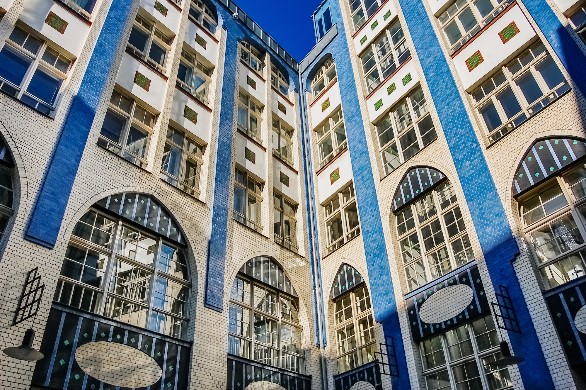 Berlin, Germany - June 7, 2019: Modern building in a Berlin neighborhood, of white and blue bricks.